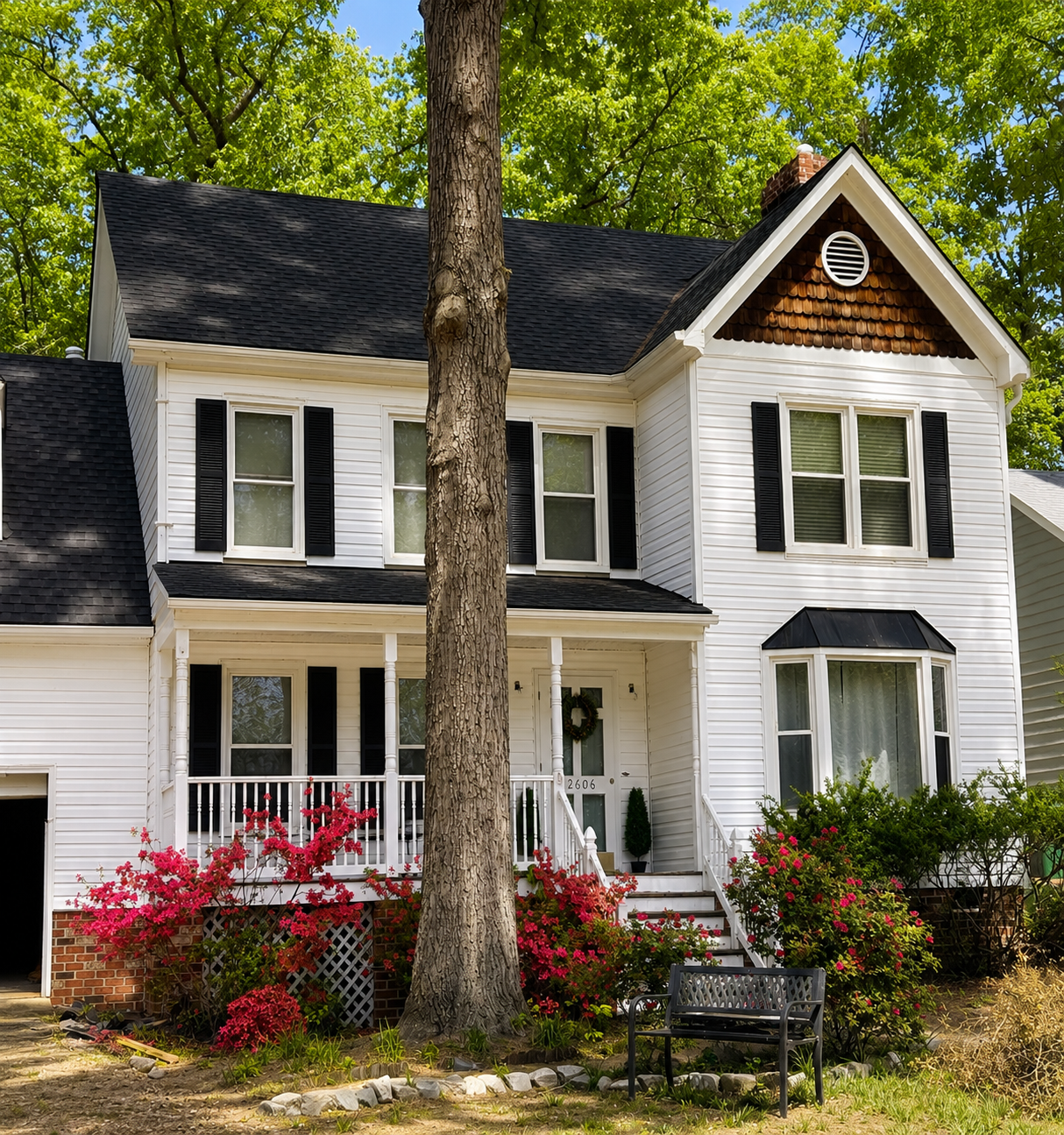 The exterior of Serenity Co-Living Residence surrounded by trees and flowers